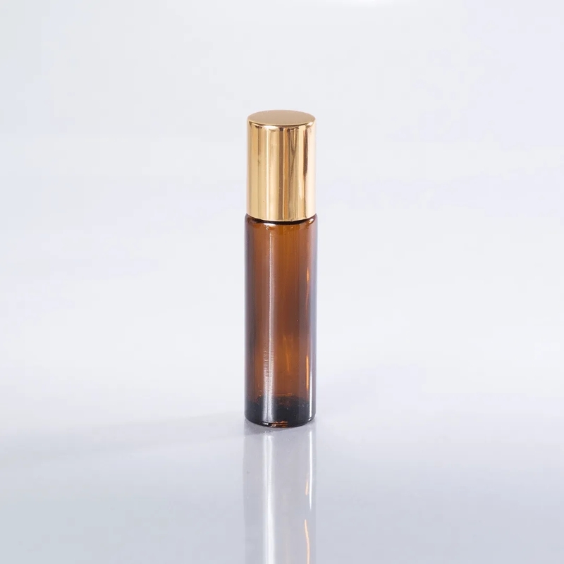 10 ml AMBER Glass Round Bottle + Steel Roll On + Gold Cap
